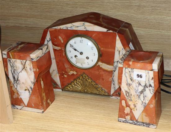 A French Art Deco rouge marble clock garniture